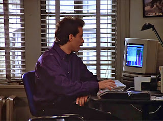 Jerry Seinfeld is using his computer